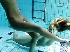 Girls tear off their bikinis underwater