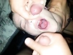 Slutty amateur girl worships two cocks and gets facialized