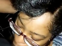 Nerdy ebony girl works her sexy lips on a thick black cock
