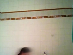 Brunette amateur showing hot boobs in the shower