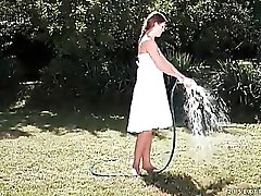 Girl washes pussy with a hose outdoors